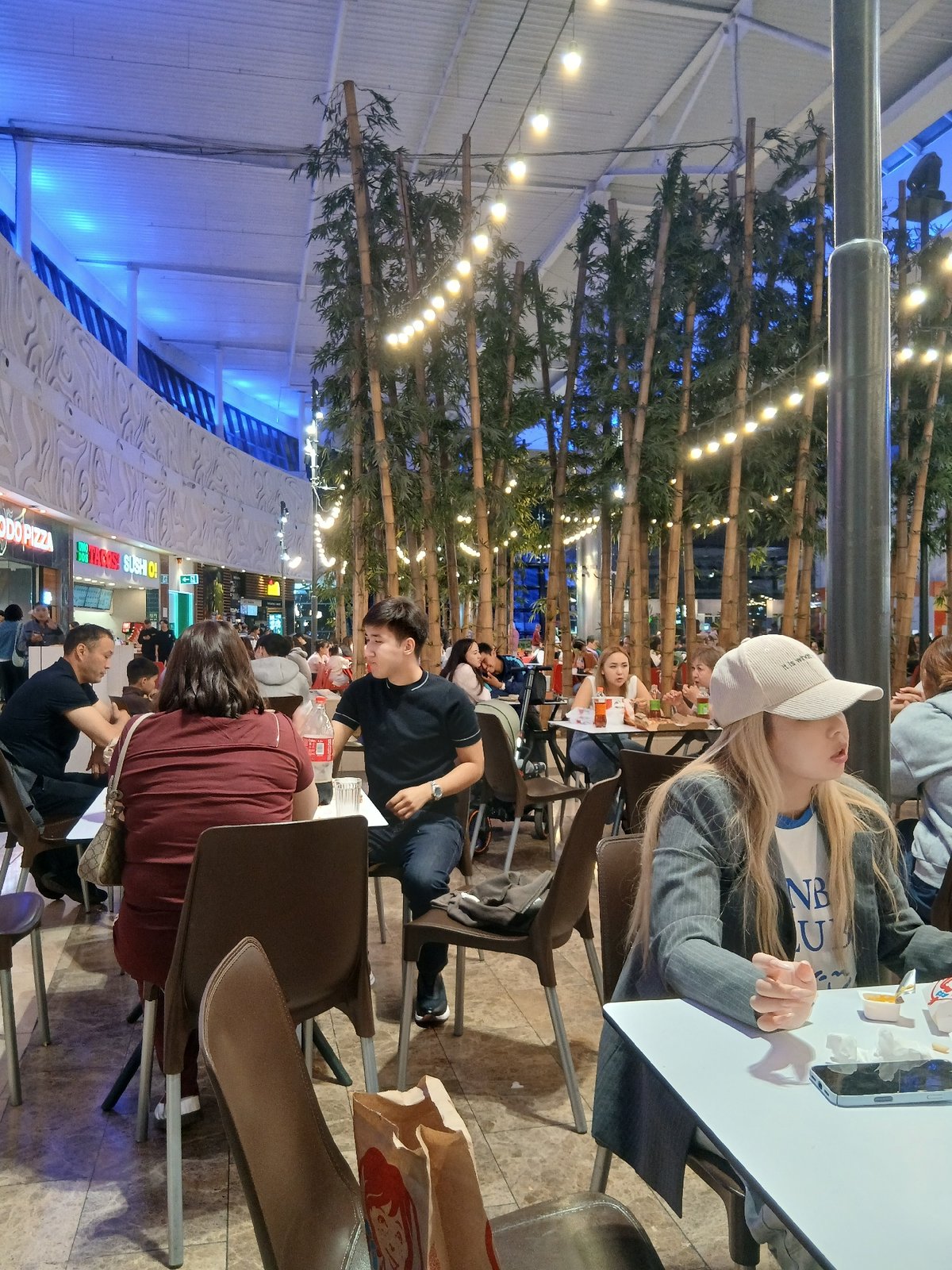 Afternoon at an Almaty shopping mall, inside and out