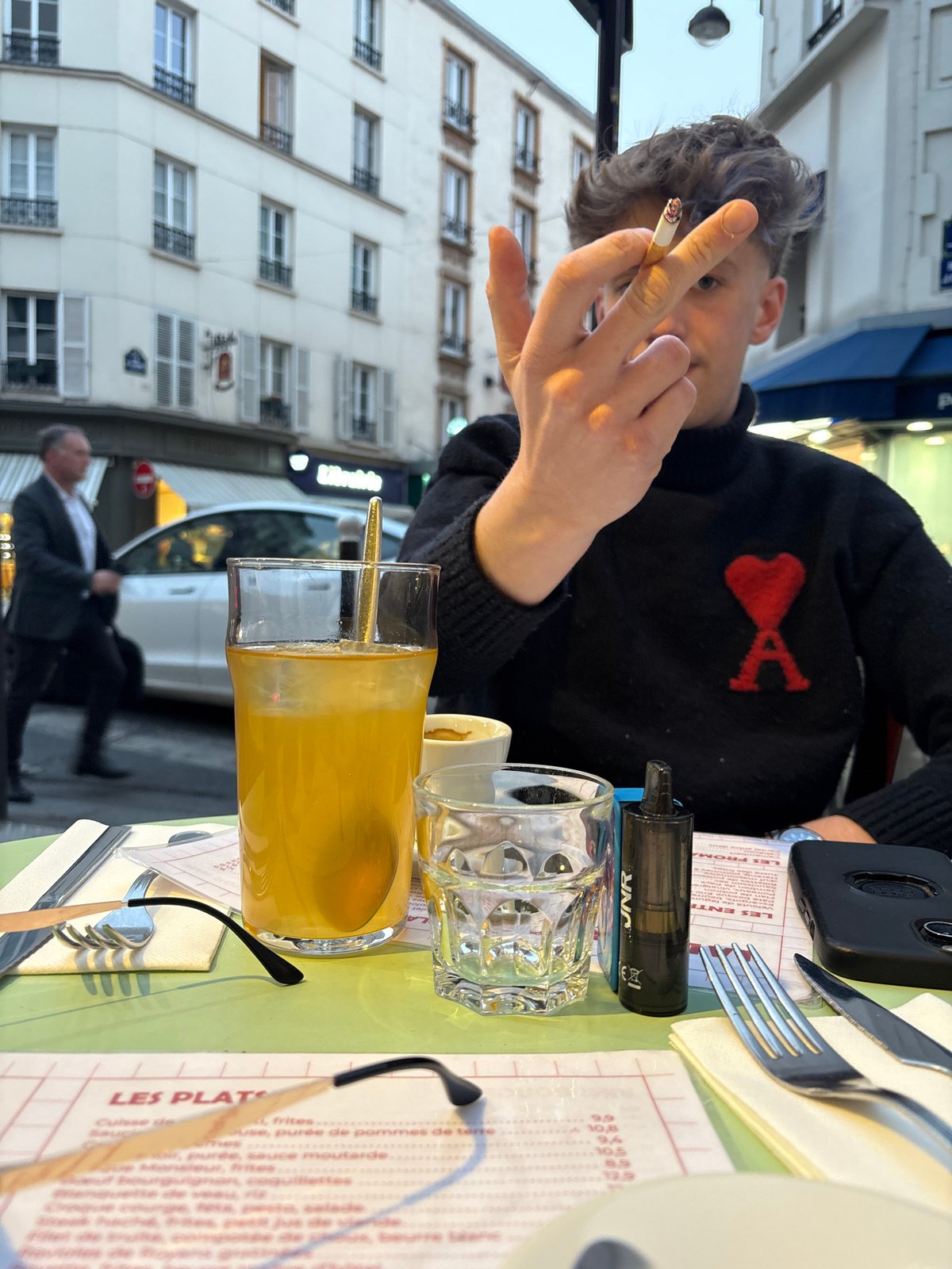 Twilight dining captured at Paris cafe on Rue Juge
