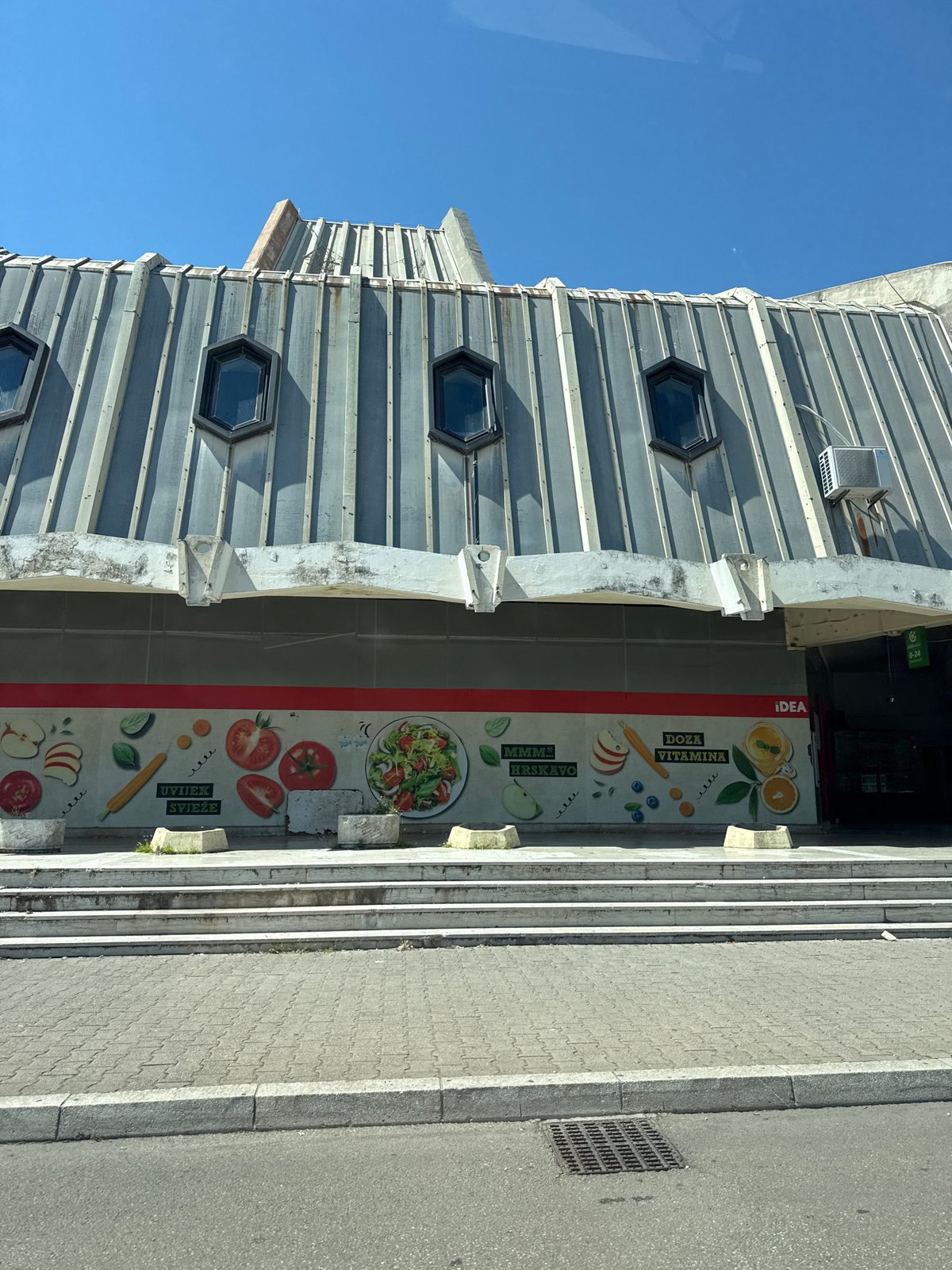 Driving through sunny Bar, Montenegro with mountain views
