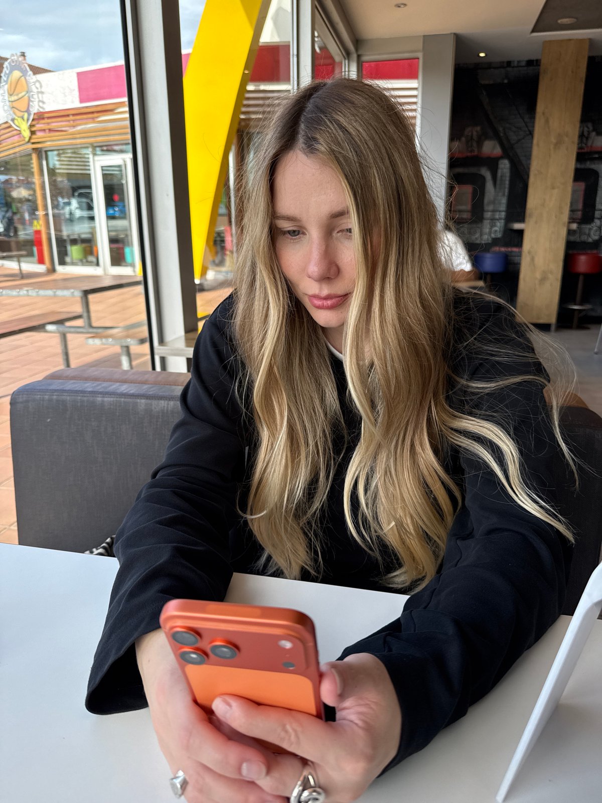 Woman dines at McDonald's in Santiago de Compostela