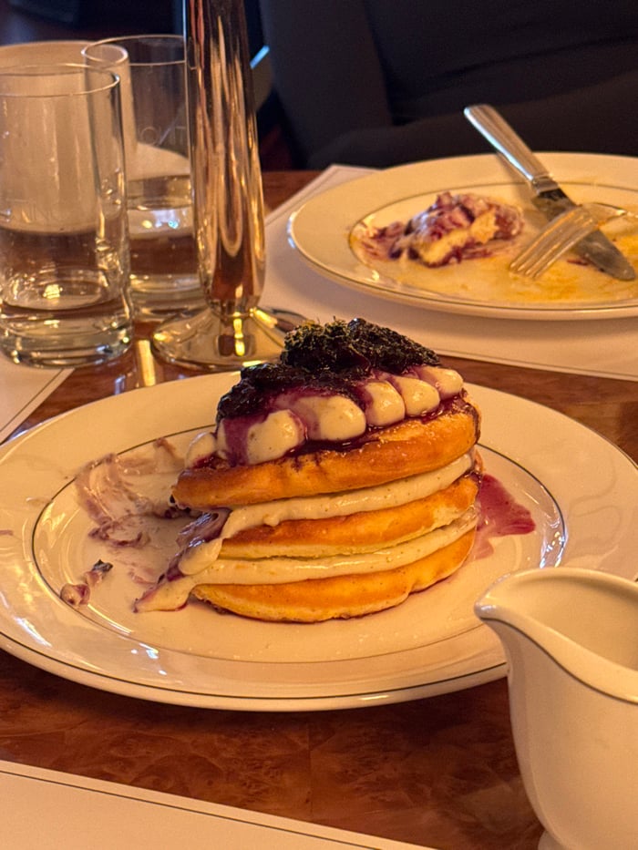 Diners enjoy gourmet pancakes at upscale restaurant