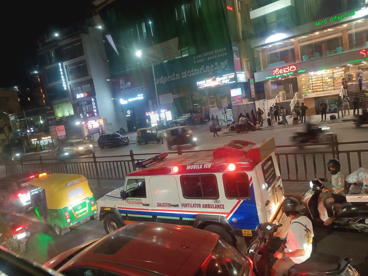 Emergency ambulance responds on Bengaluru street at night