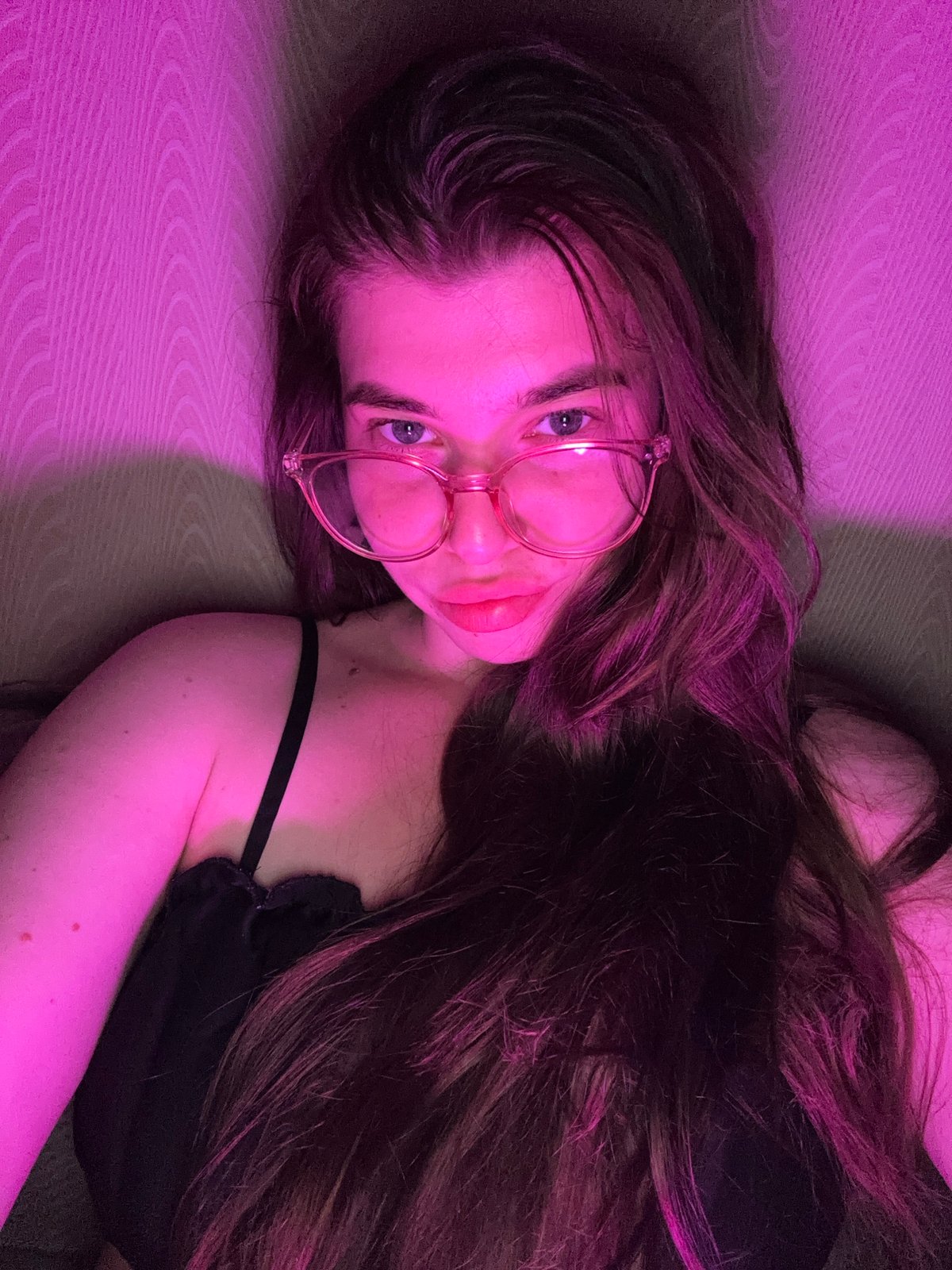 Indoor photo session with pink lighting in Мещёры