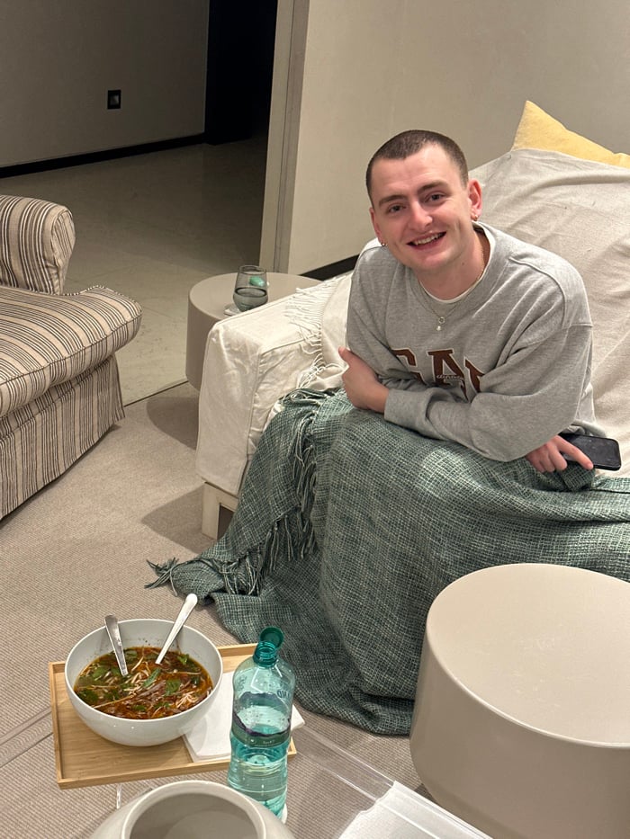 London resident enjoys Vietnamese takeout during cozy evening at home