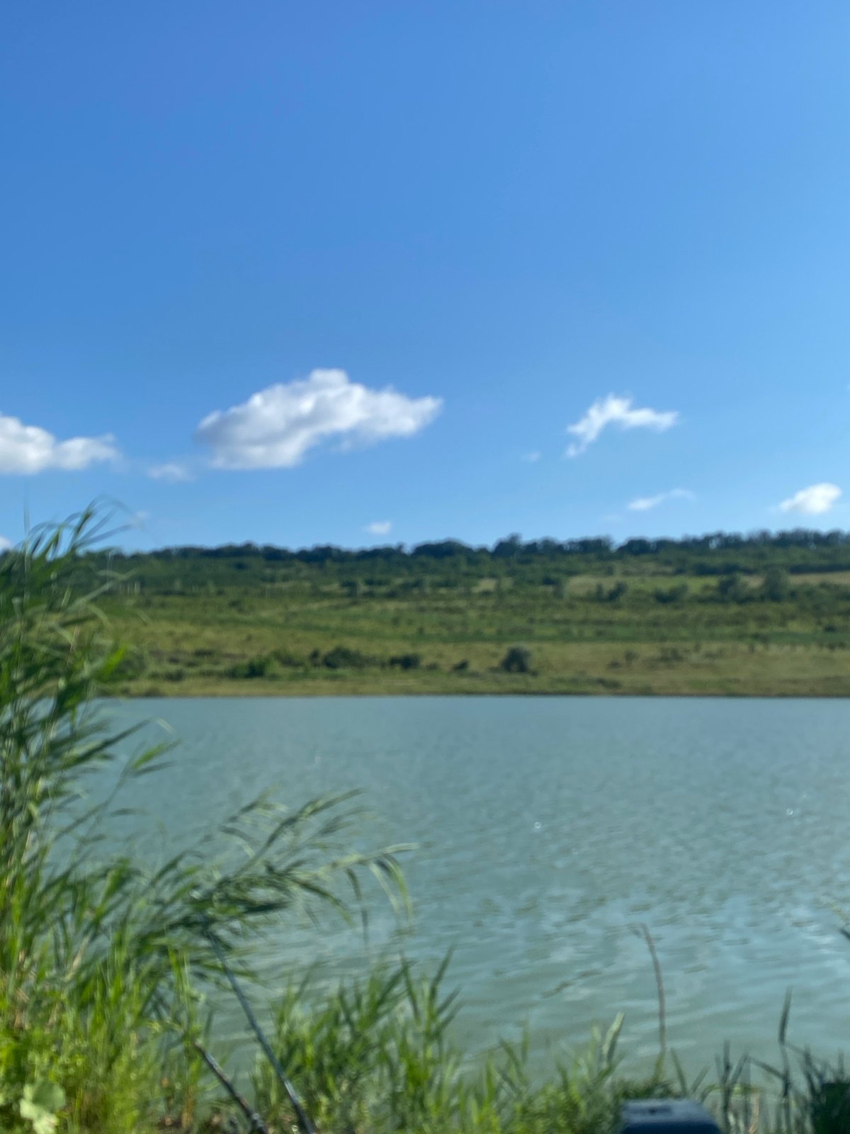 Calm lakeside scenery in rural Moldova on a summer morning