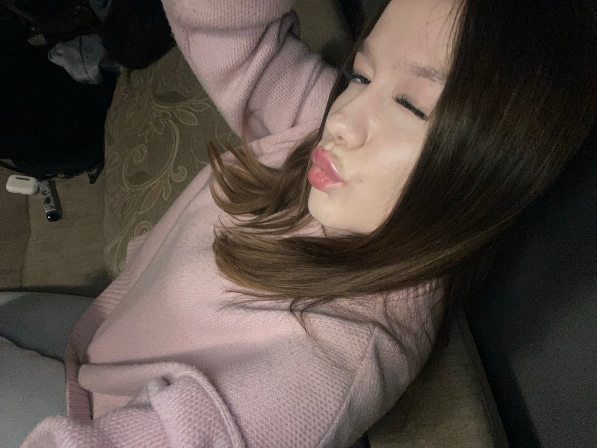 Woman in pink sweater documented in casual moments, Chaikovsky