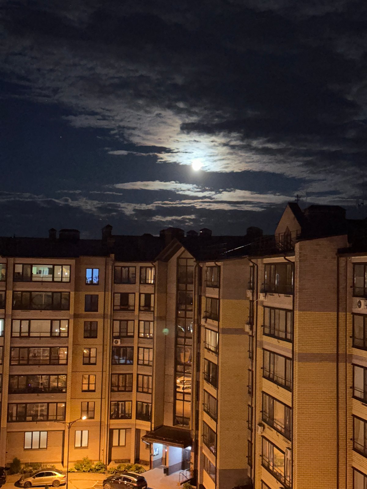 Bright moon observed over Vladimir, Russia buildings at night