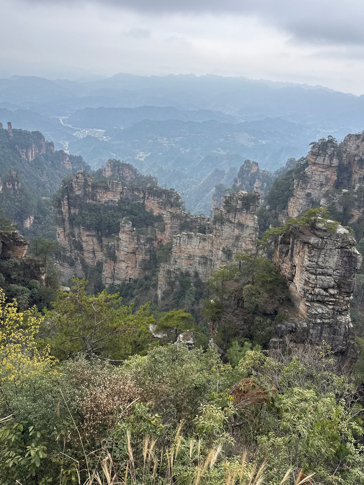 Sandstone pillars and mountain landscape documented in Zhonghu, China