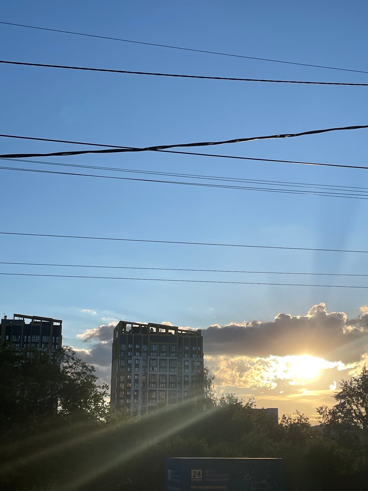 Sunny afternoon life documented across Izhevsk neighborhoods