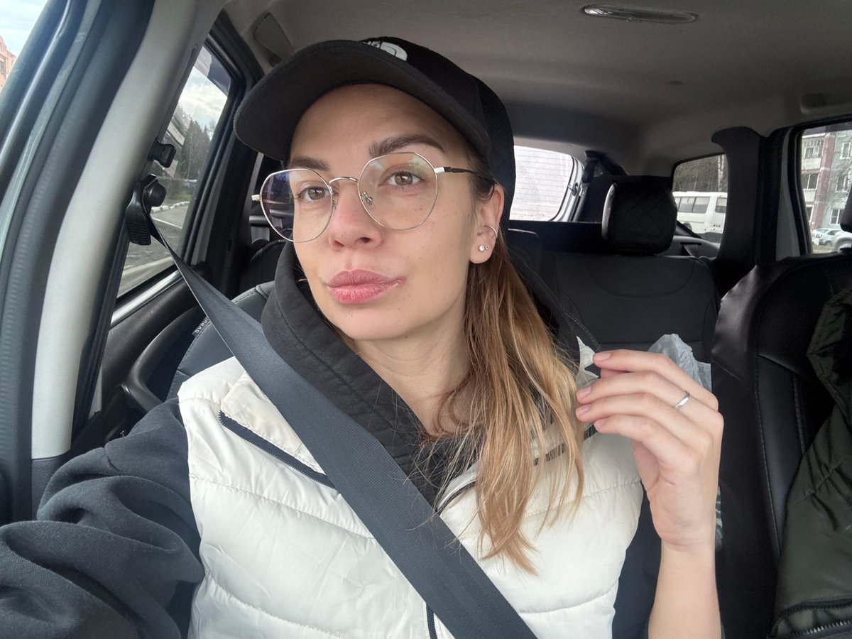 Woman takes selfie in car in Ust-Ilimsk, Russia