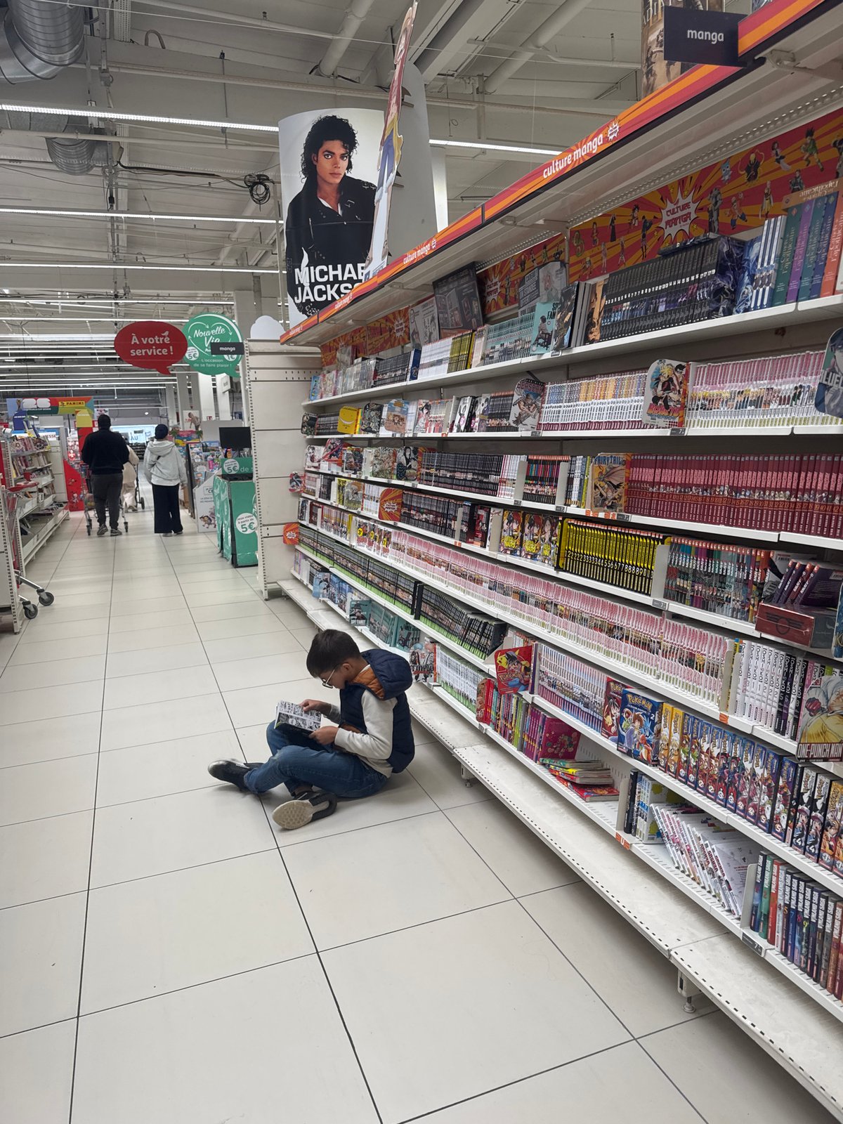 Shopper browses anime merchandise at specialty store in Leers