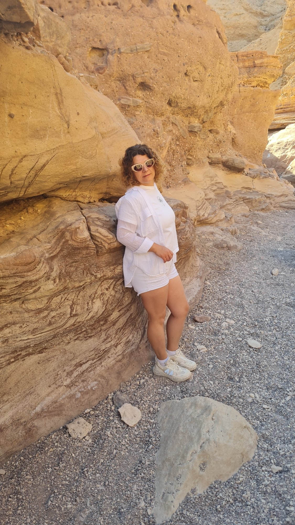 Tourists photograph desert canyon adventure in southern Israel