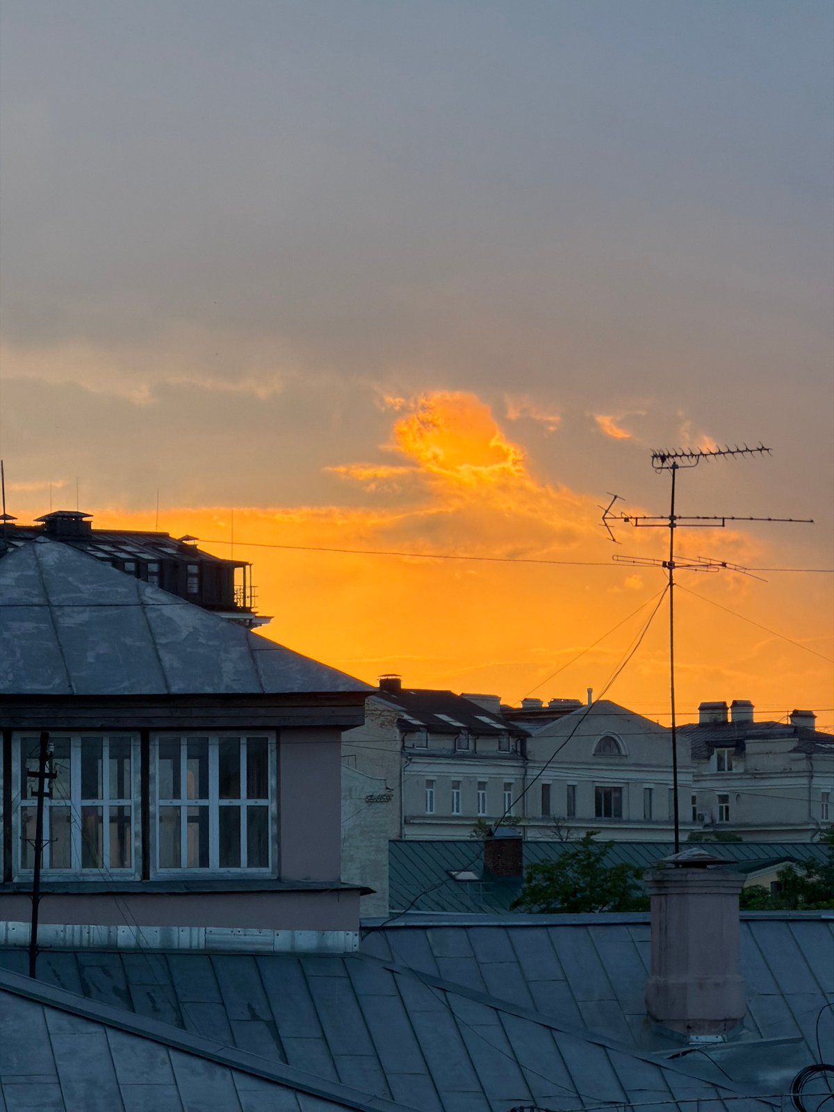 Sunset cityscape captured over Moscow rooftops