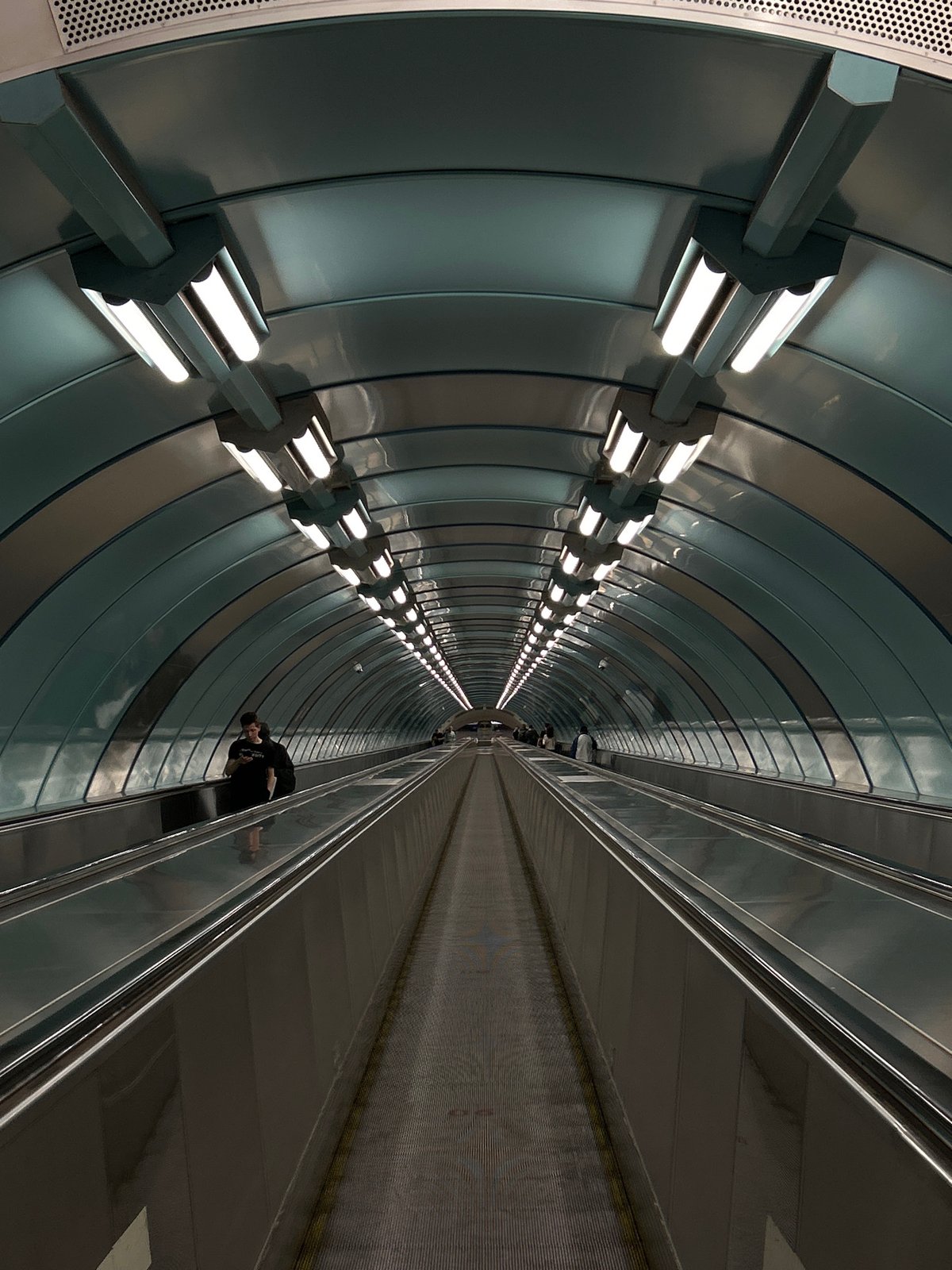 Riding the deep escalators at Krestovsky Ostrov metro station
