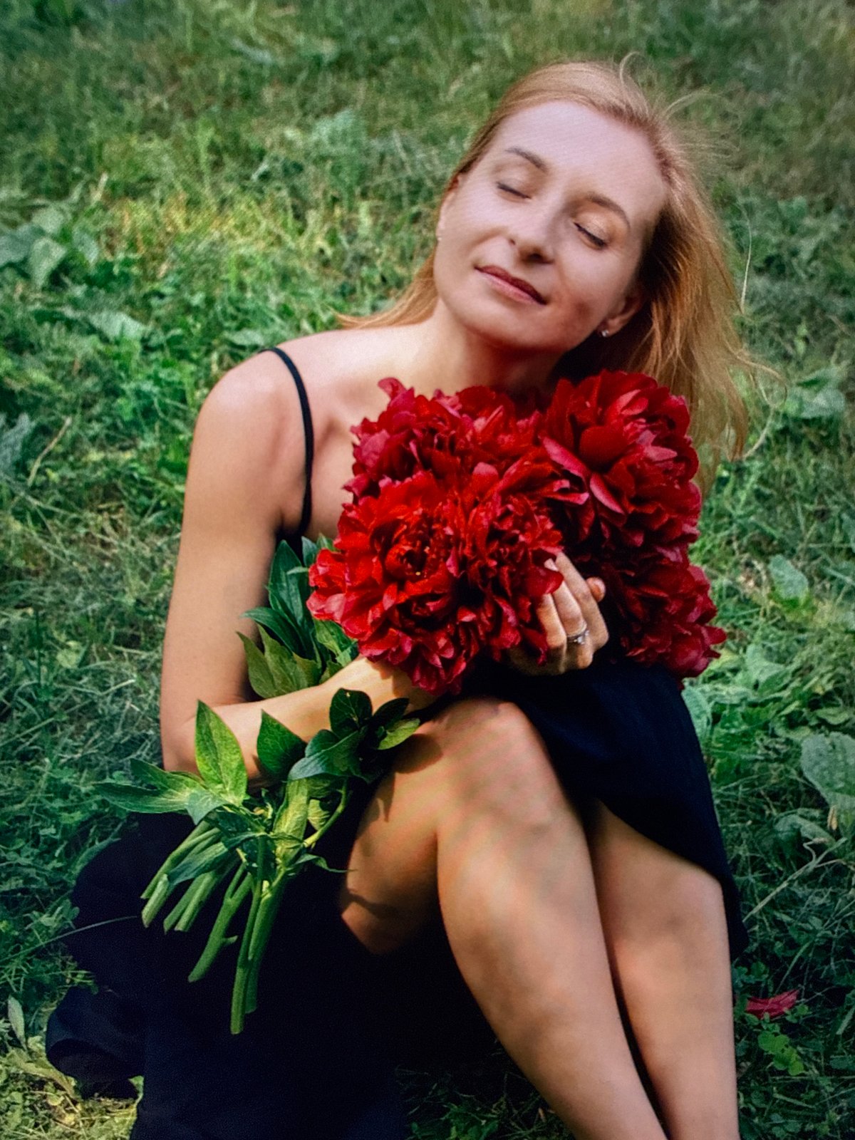Red peonies and quiet interior details, Sochi summer evening