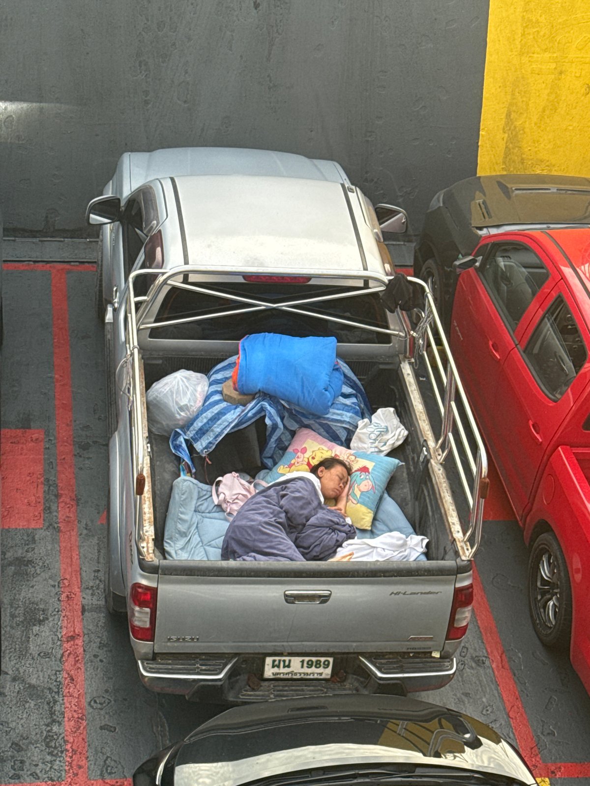 Ferry crossing from Don Sak, cars on deck, coastline in view