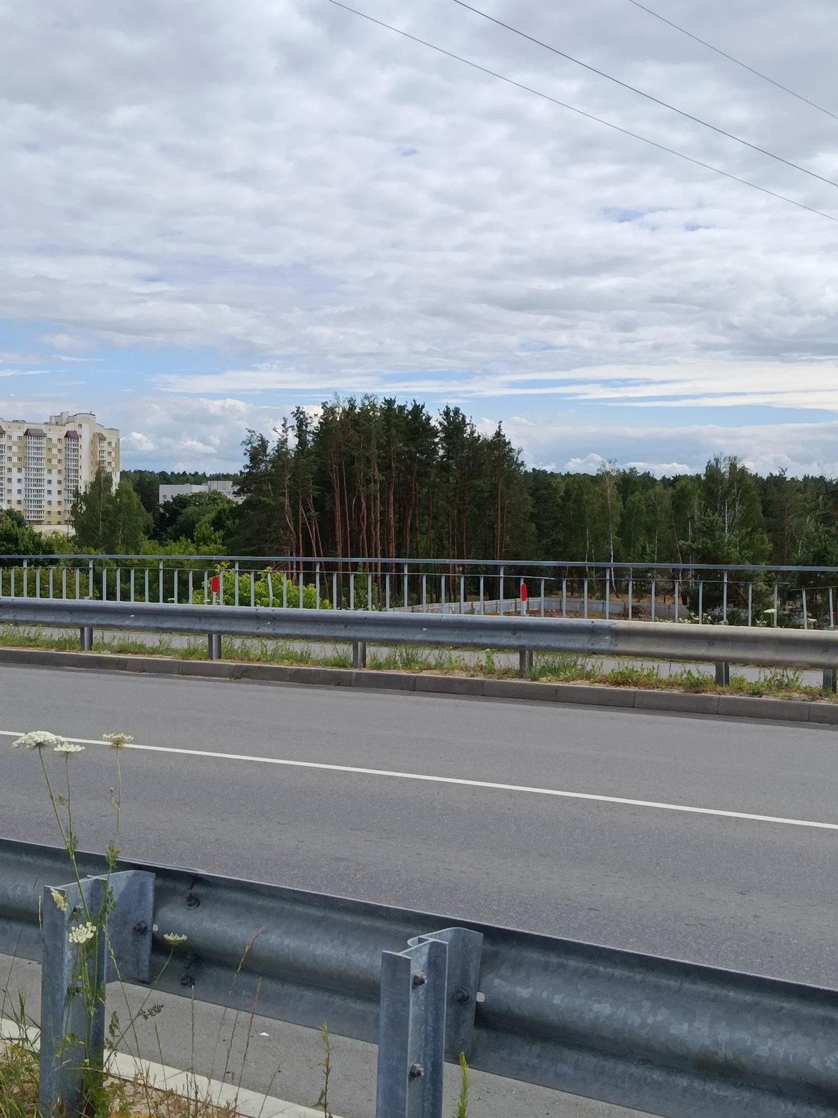 Overcast afternoon in Svietlahorsk: roads, rail yards, and Soviet-era suburbs