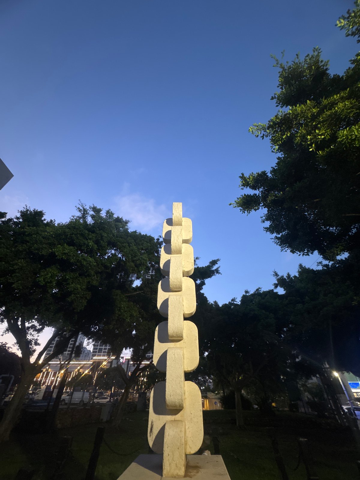 Afternoon at a Bat Yam park with a large sculptural landmark