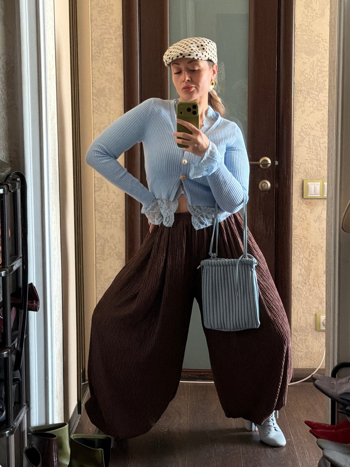 Woman takes mirror selfie indoors in Krasnoyarsk, Russia