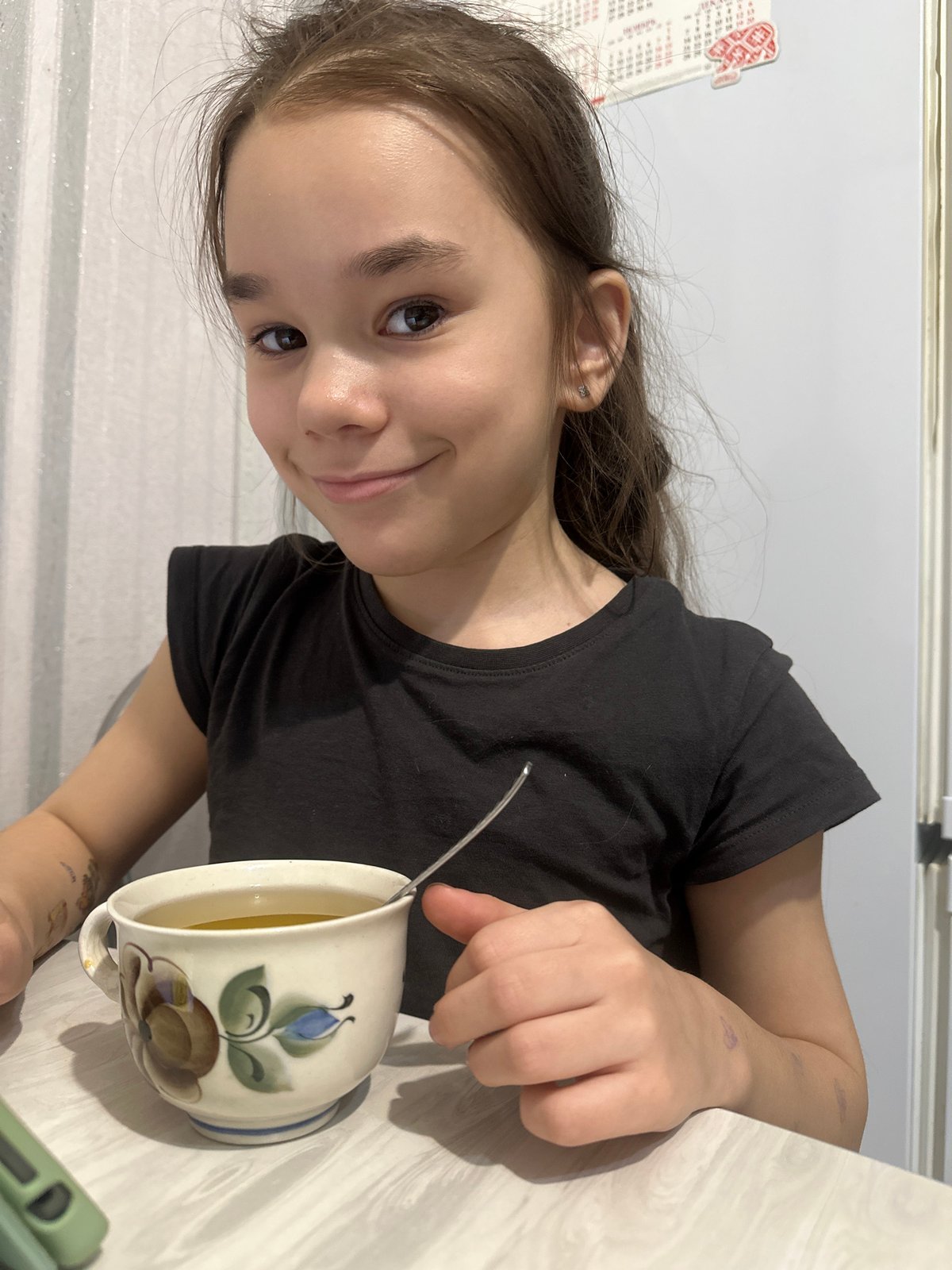 Young girl uses tablet indoors in Uva, Russia