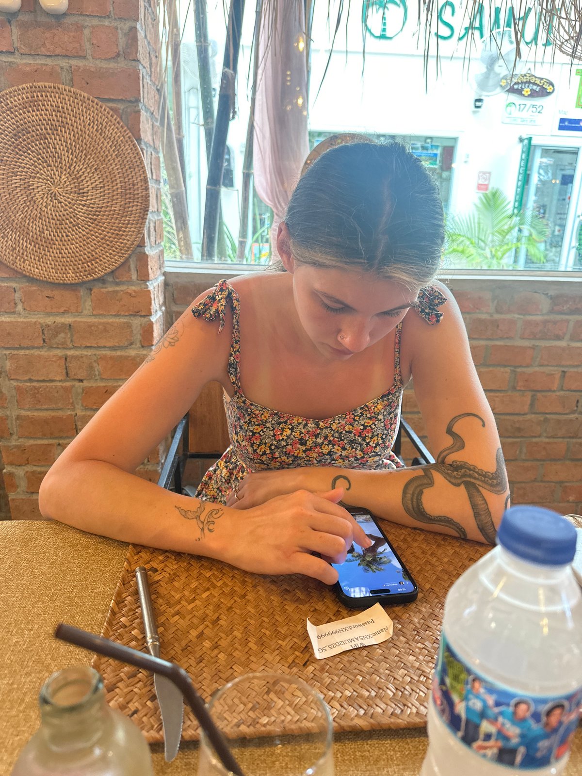 Woman dines alone at early morning cafe in Thailand