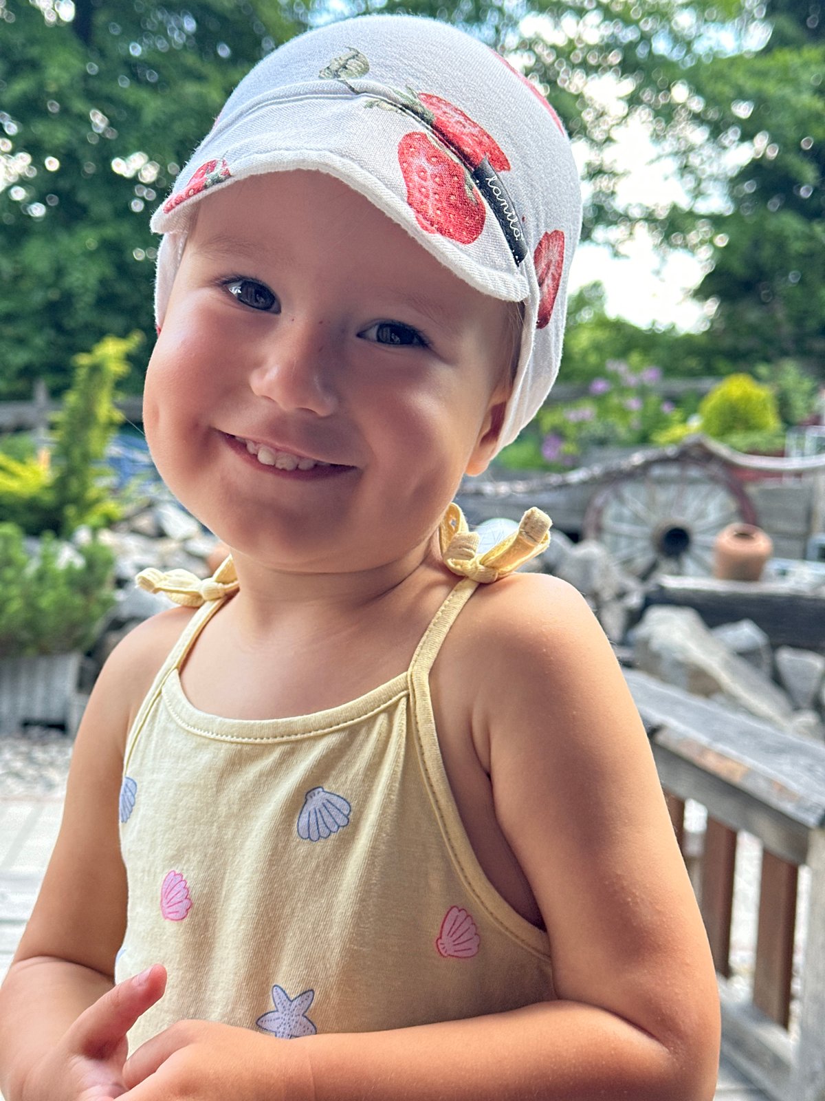 Toddler on a sunny wooden deck in Wisła, Poland