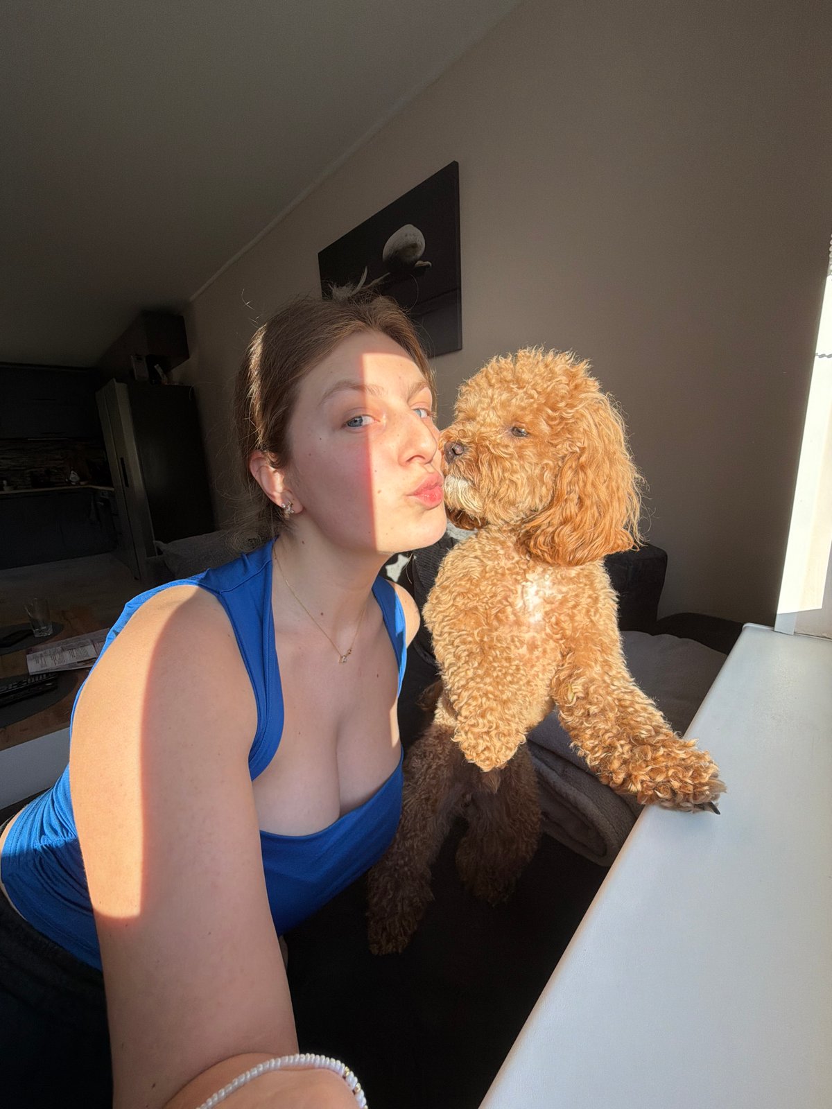 Woman takes leisurely selfies with poodle at Bulgarian home