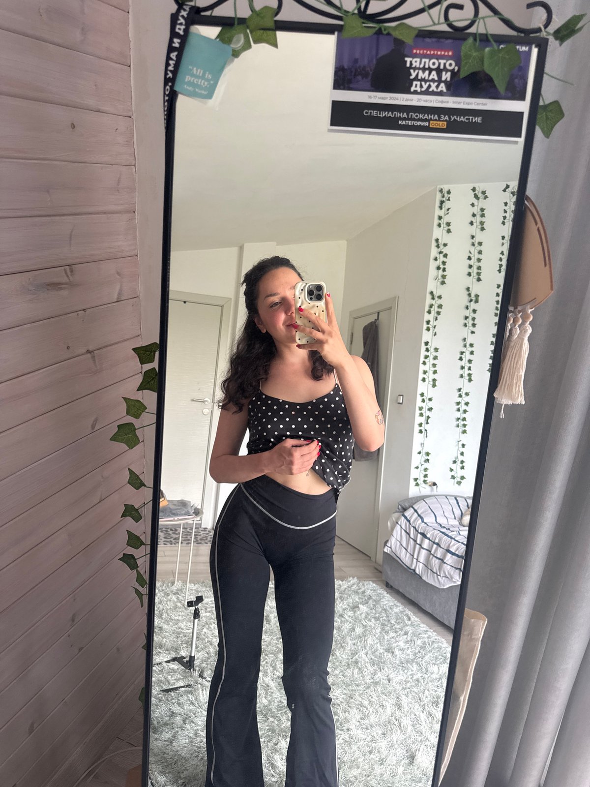 Woman takes mirror selfies in bedroom in Tvarditsa, Bulgaria