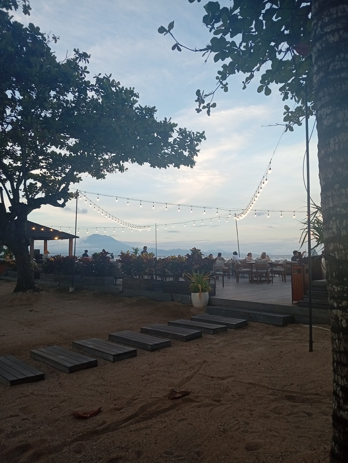 Tourist documents tropical Denpasar scenes during morning visit