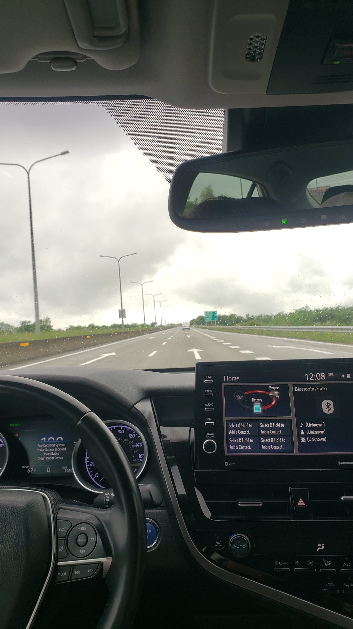 Driver documents highway journey through vehicle interior in Georgia