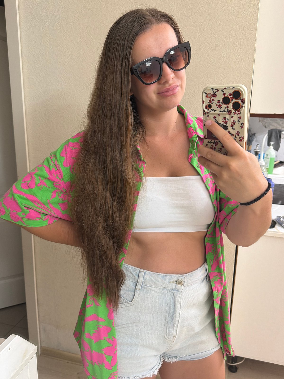 Mirror selfie session in a Sochi apartment, summer morning