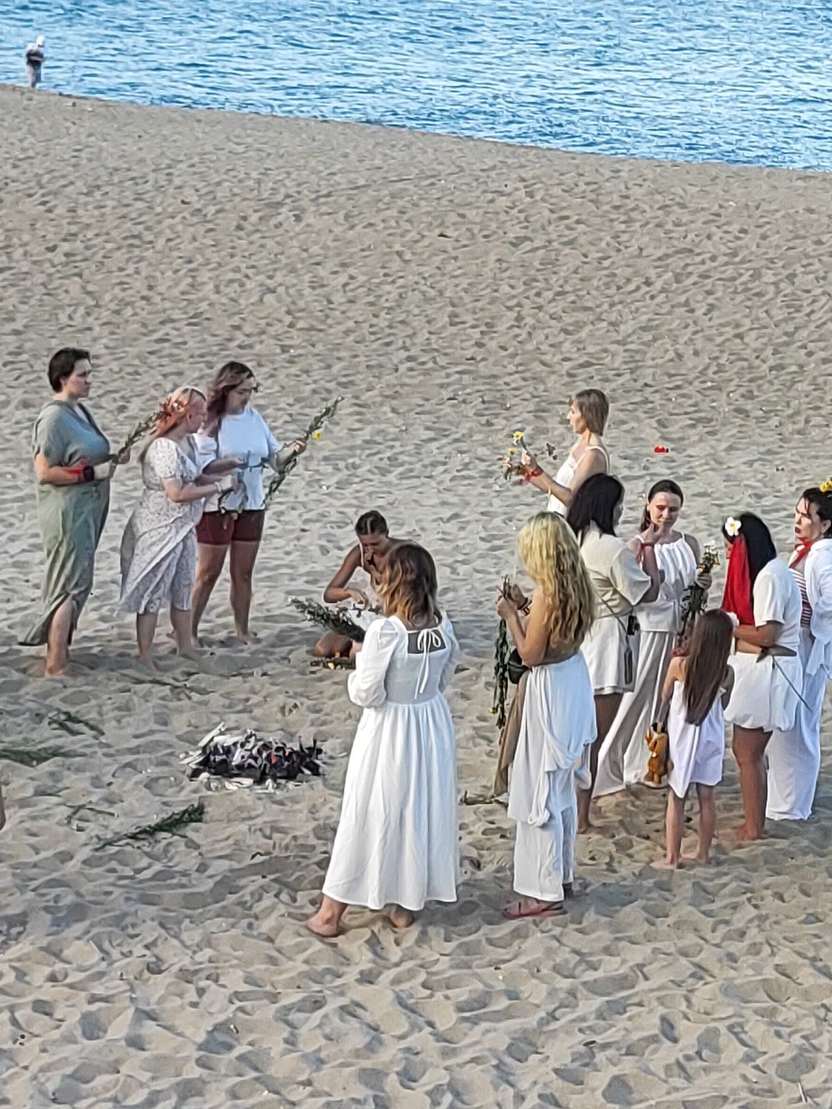 Beach ceremony, volleyball, and scooter traffic in Nha Trang