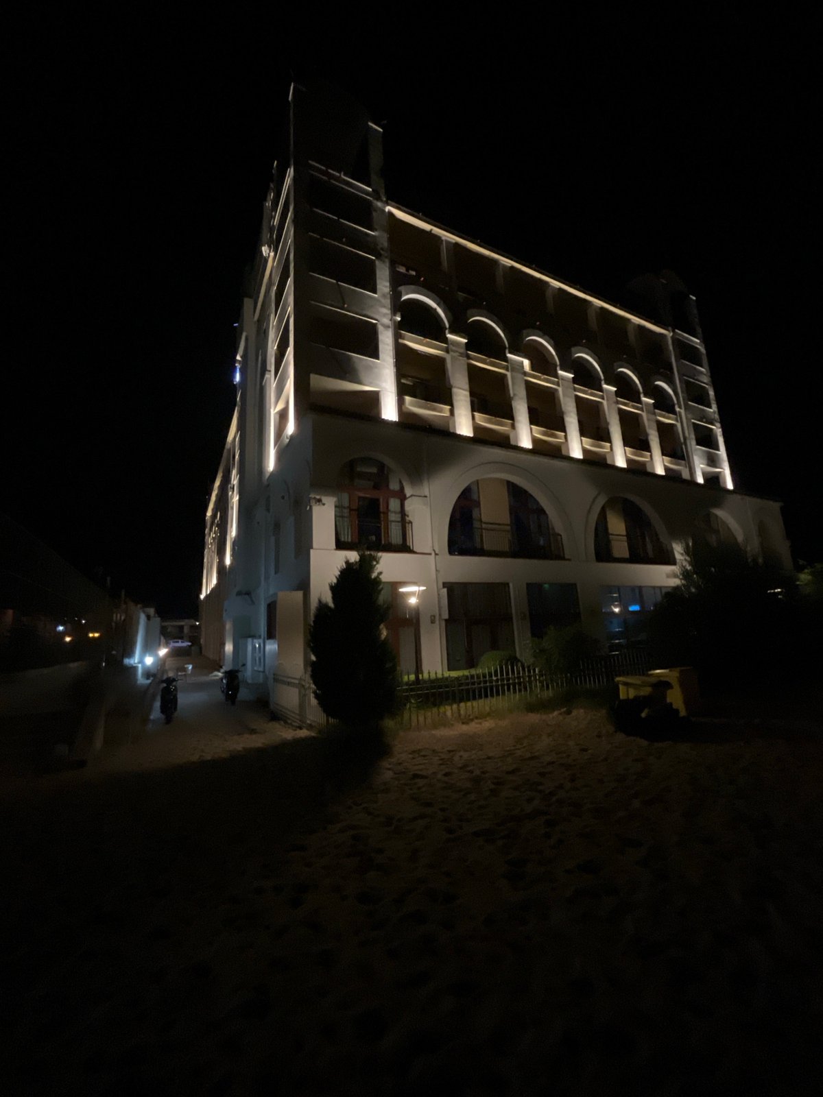 Summer night on Obzor's beachfront: hotels, moon, and promenade
