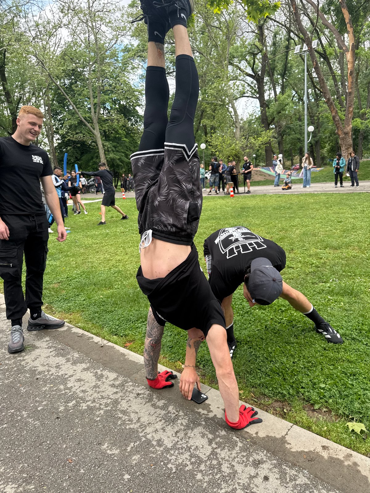 Park gatherings feature handstand performance and foam sword activities