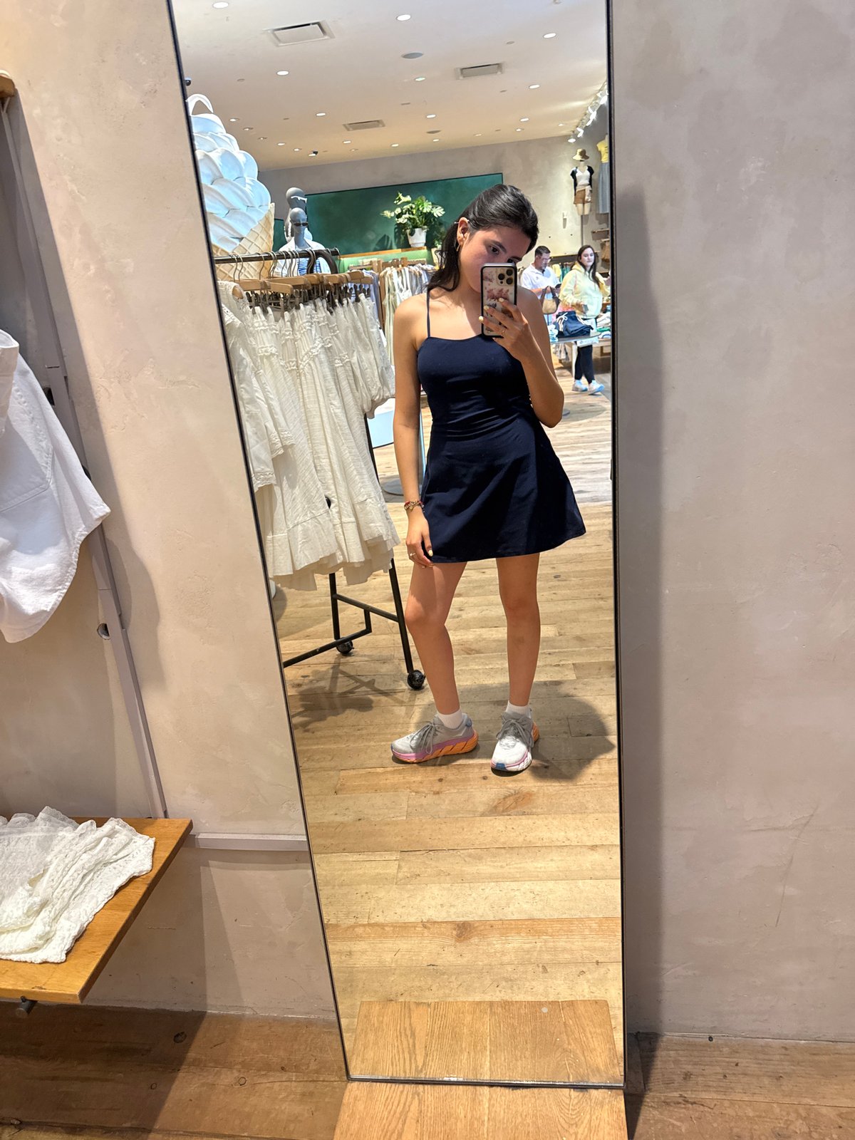 Woman takes mirror selfie while shopping at Austin Anthropologie