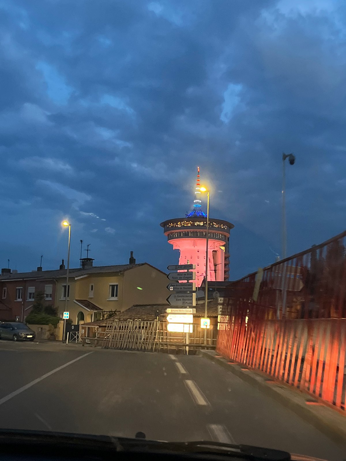 Mediterranean lighthouse illuminated against cloudy evening sky in France