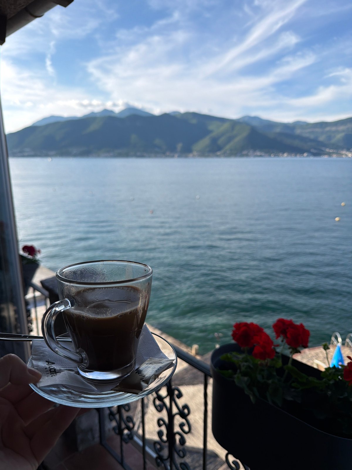 Coffee moment overlooking Montenegro's scenic waters and mountains