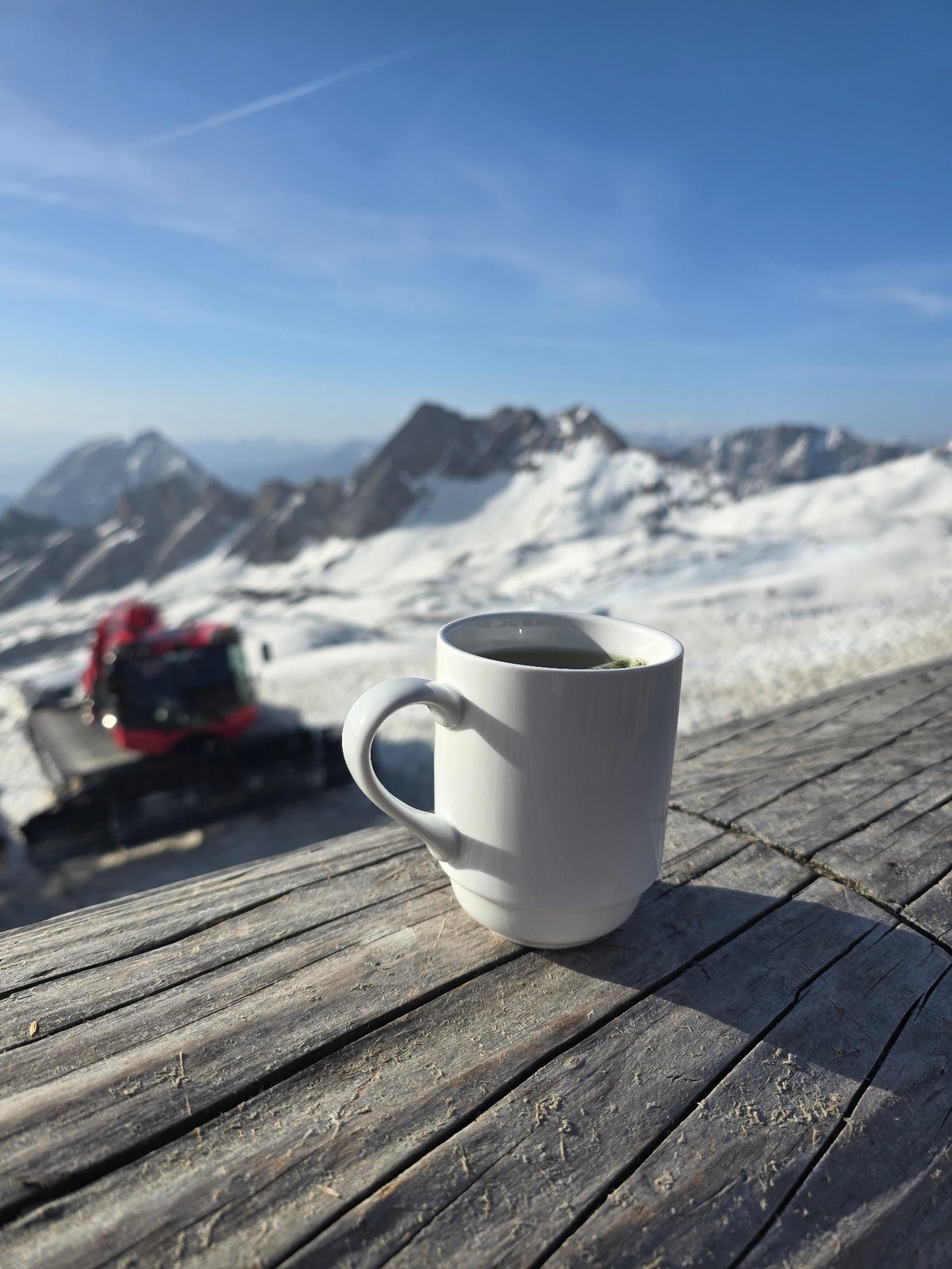 Morning coffee overlooking snowy Alps in Garmisch-Partenkirchen