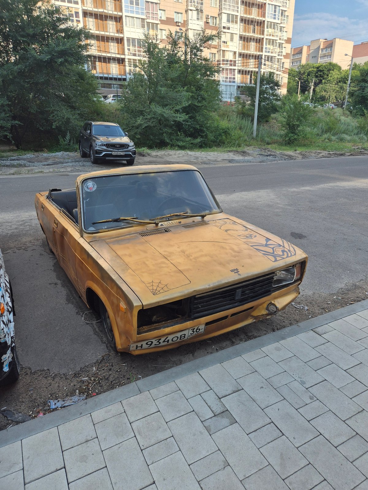 Two custom Lada convertibles parked on a Voronezh street