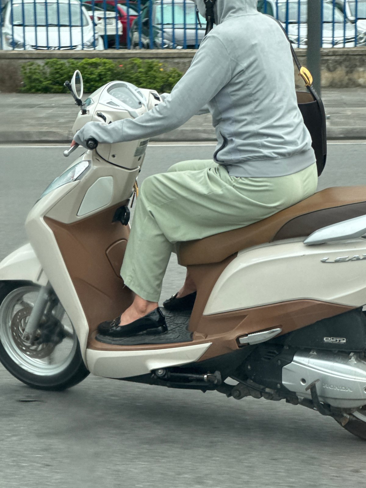 Weekday morning traffic flows through Huế's riverside wards