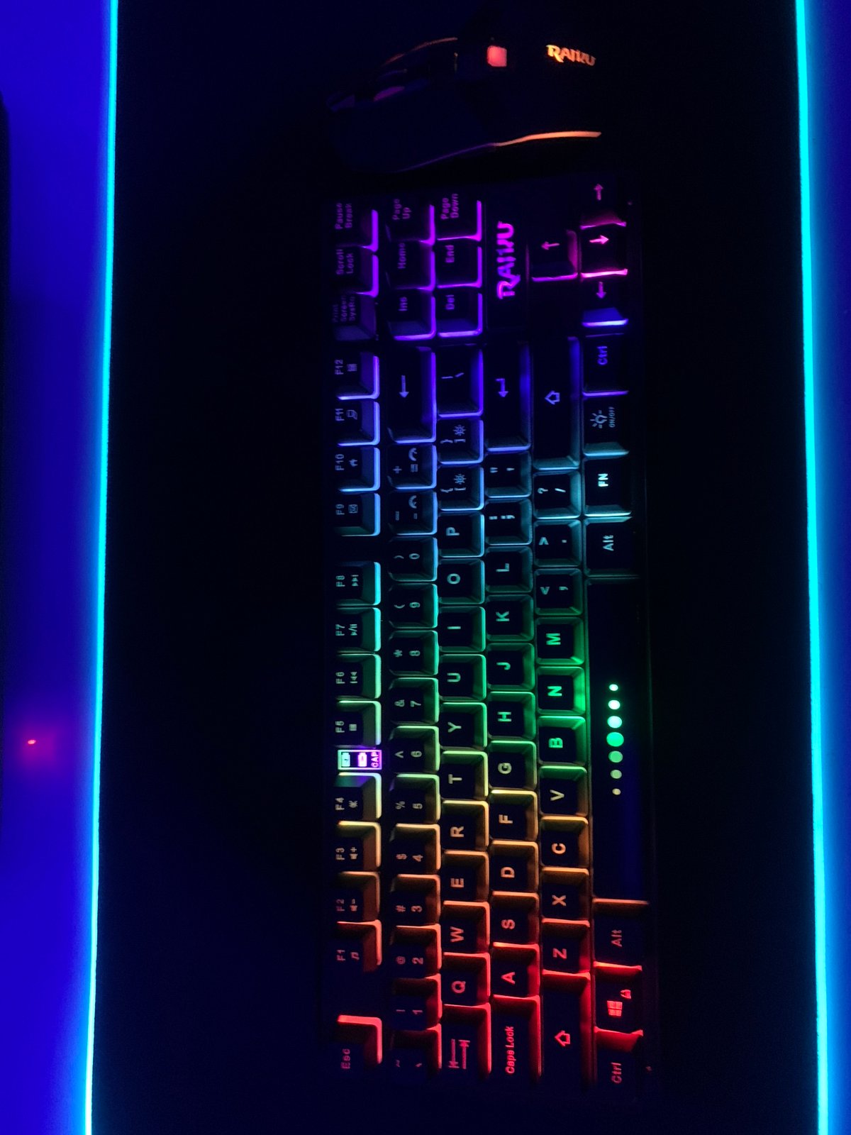 Gaming setup with illuminated mechanical keyboard observed in Lagos