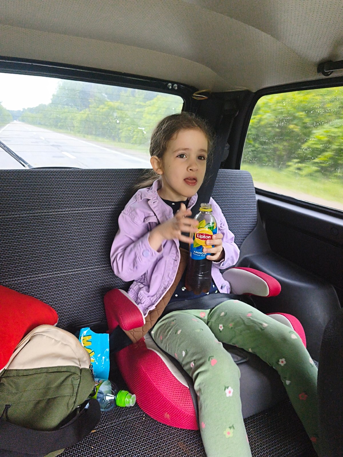 Child in booster seat observed in Niva, Russia