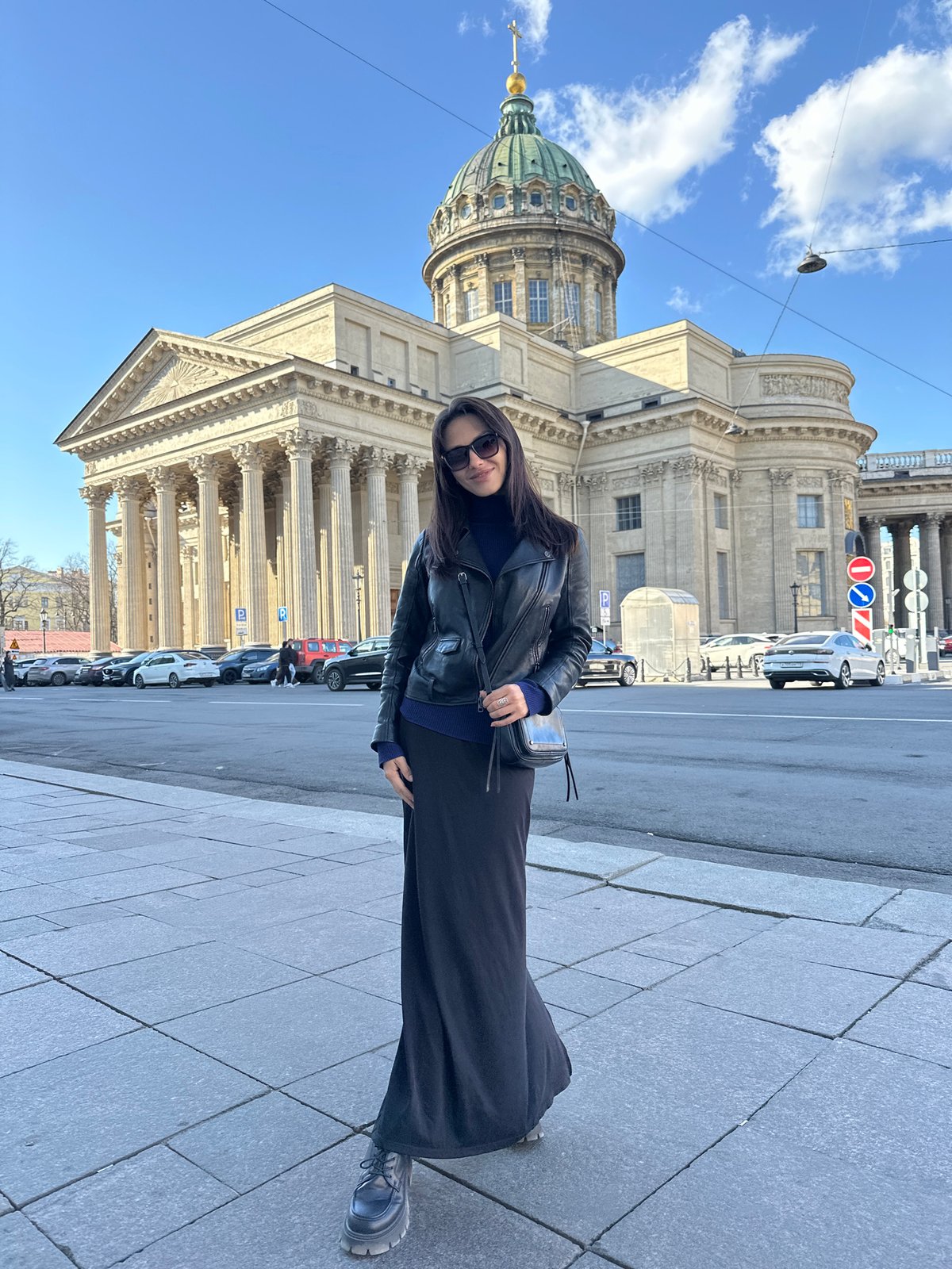 Tourists visit Kazan Cathedral on sunny afternoon in Saint Petersburg