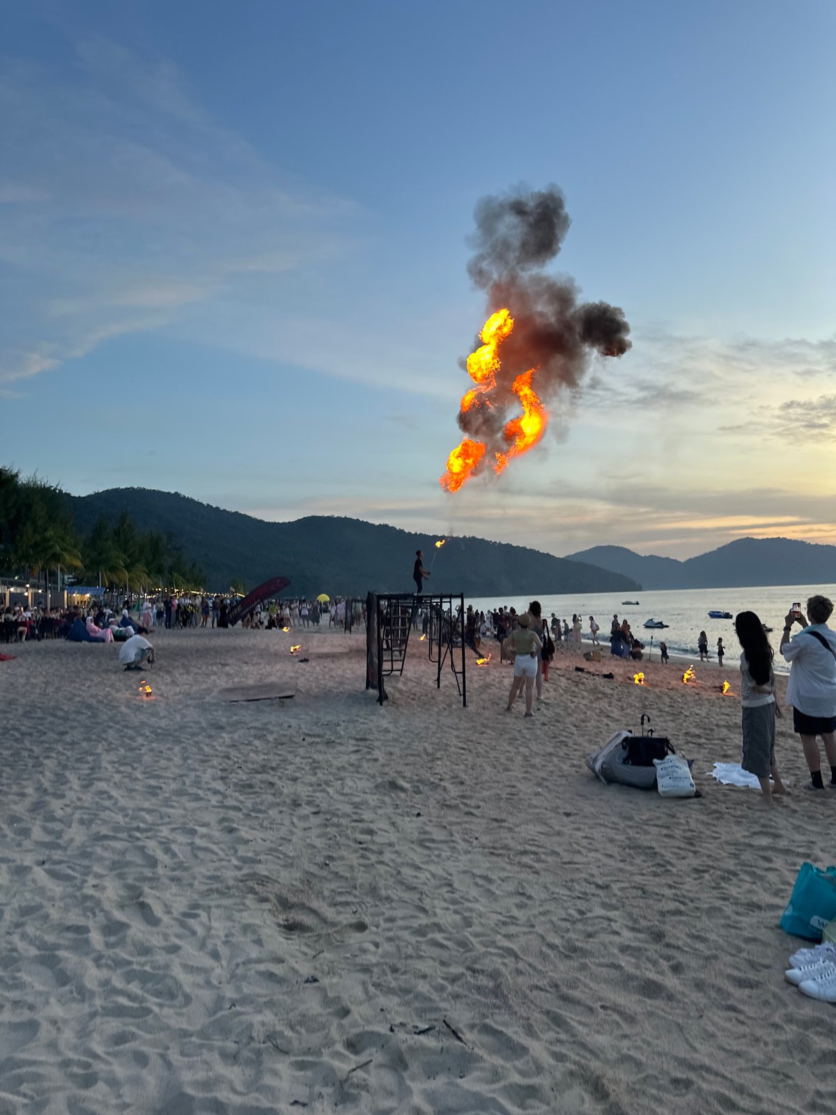 Fire performance on a George Town beach at sunset
