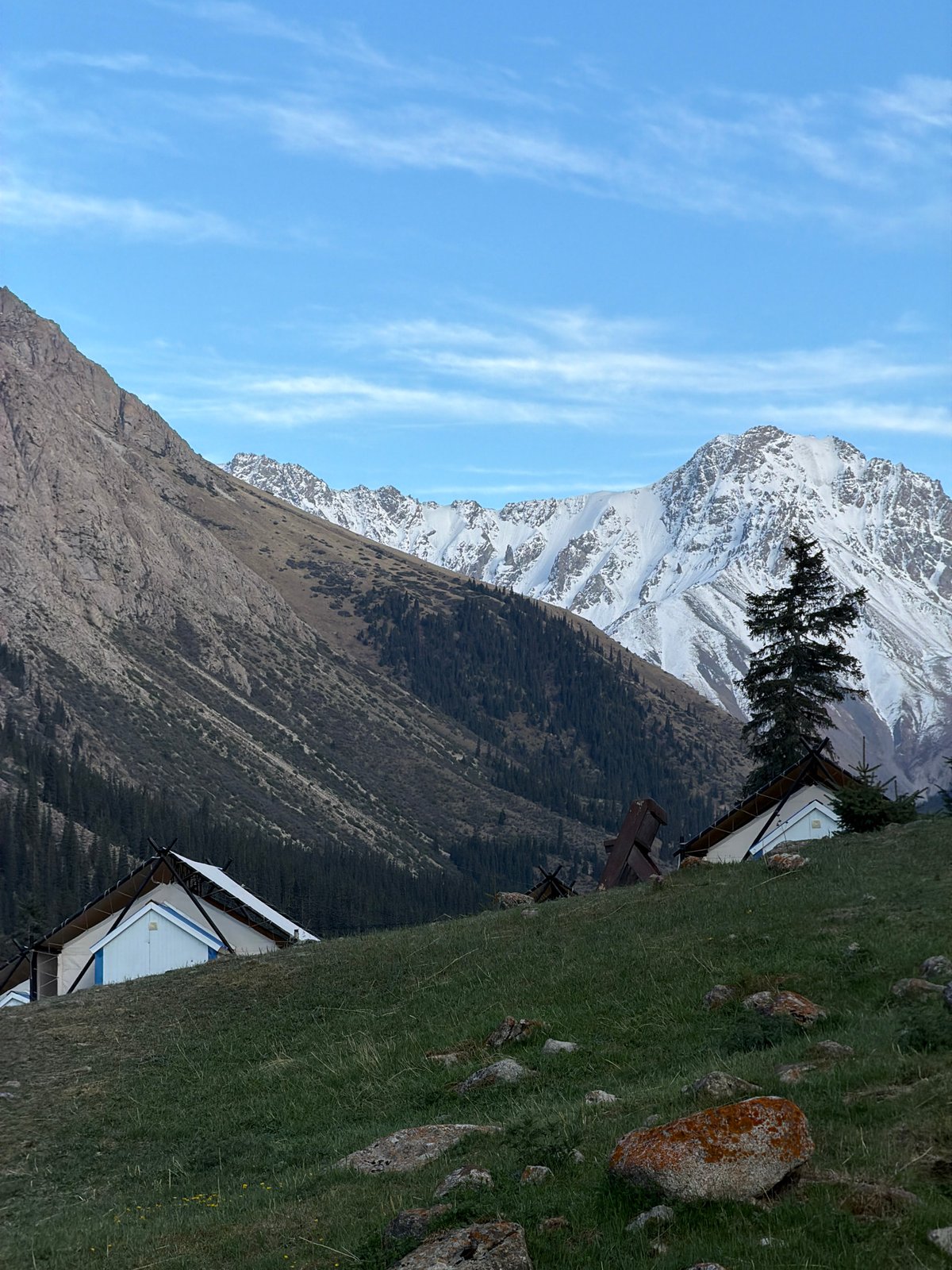 Traditional Kyrgyz mountain landscape with yurt documented by witness