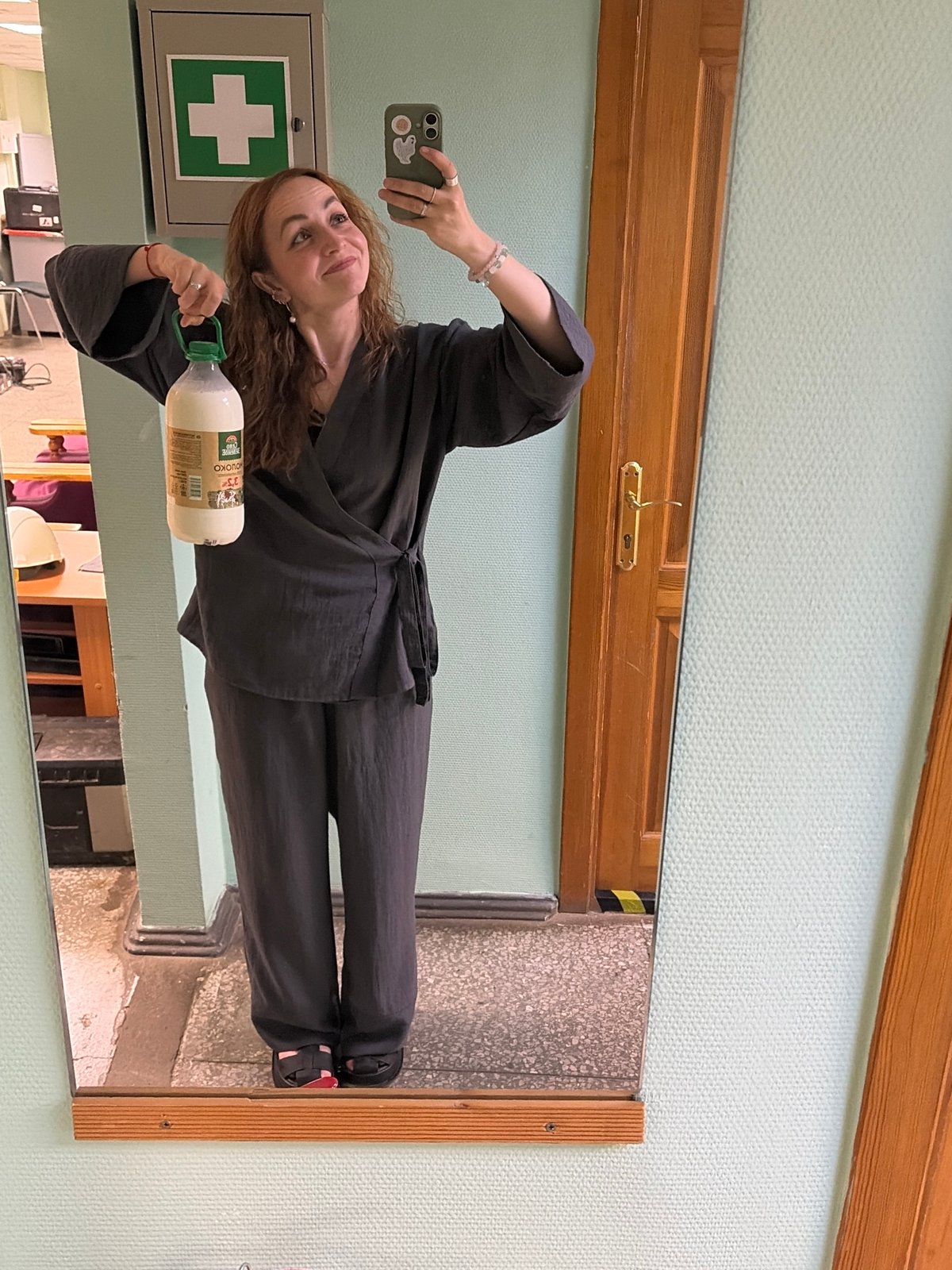 Late night mirror selfie with milk bottle in Chaikovsky