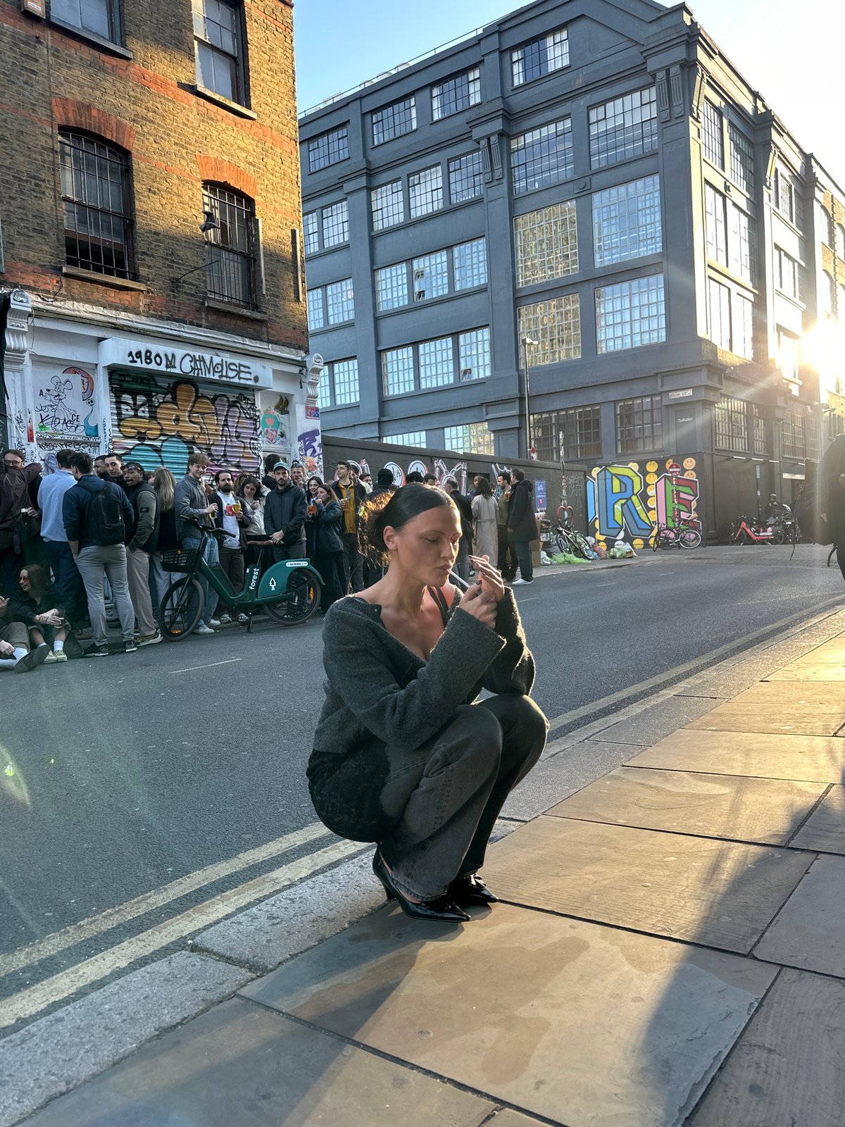 Woman photographed in various London locations during evening hours