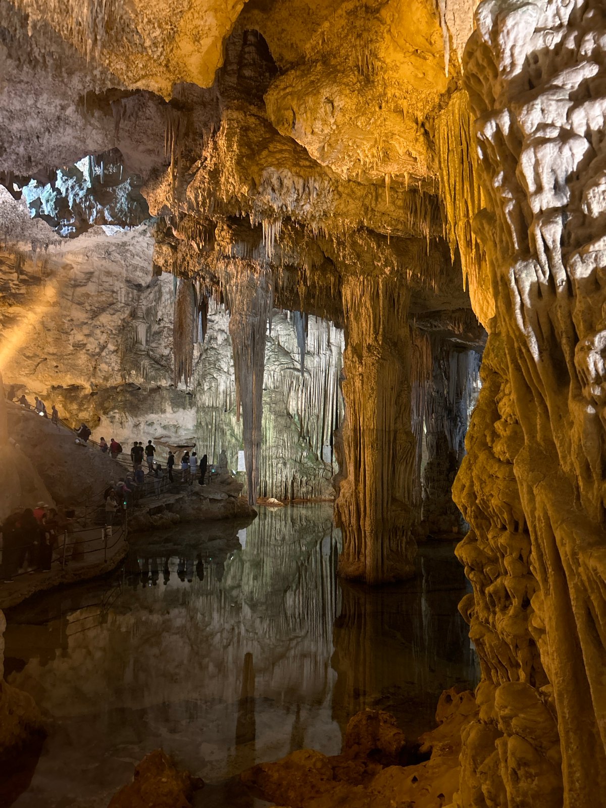 Tourists explore Neptune's Grotto cave system near Alghero, Italy