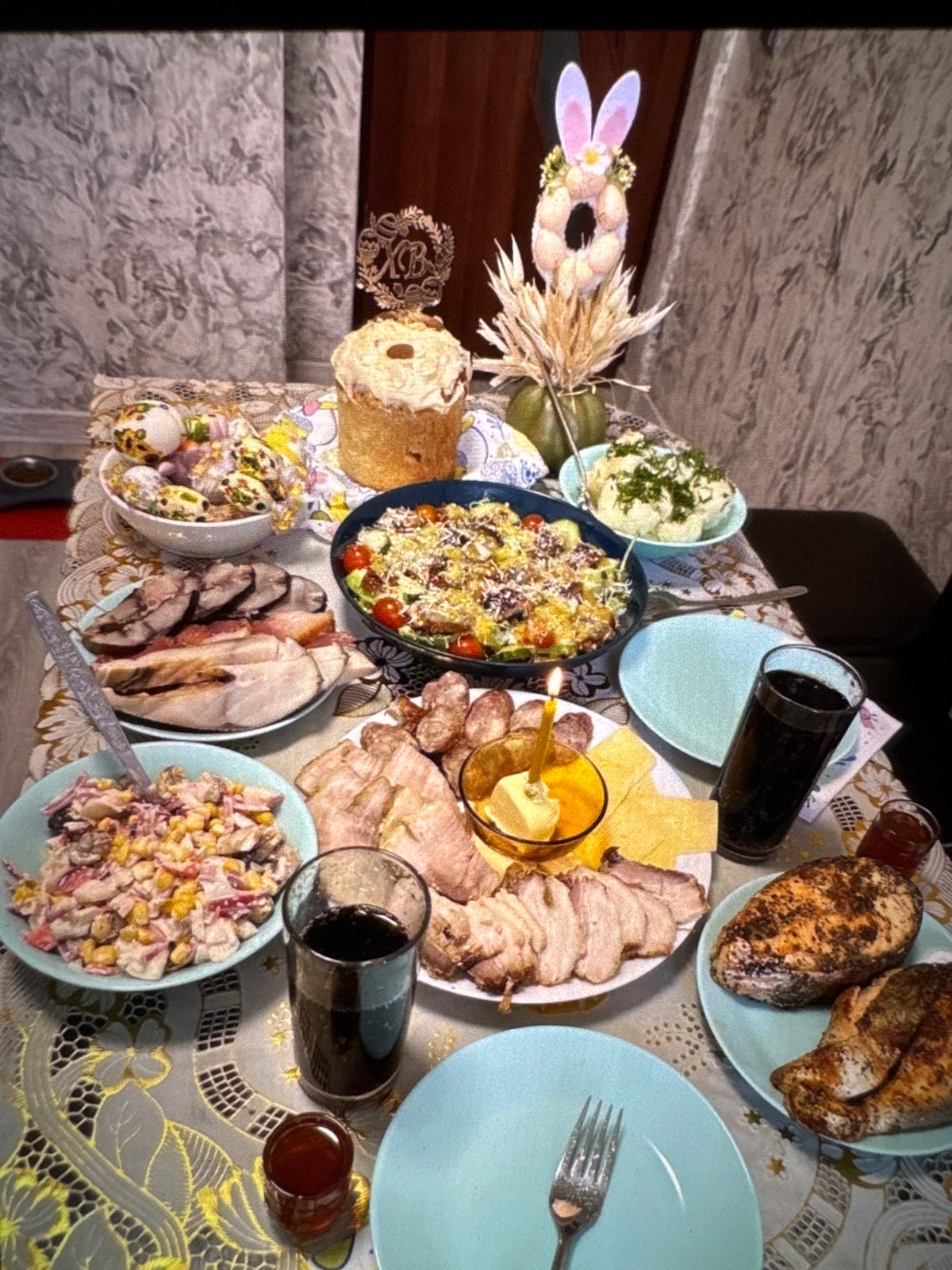 Food, flowers, and plush pigs in a Warsaw evening spread