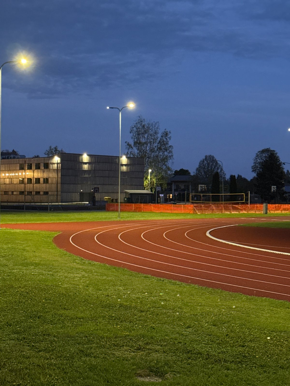 Evening view of illuminated running track in Carnikava, Latvia